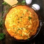 Canadian Bacon and Brie Quiche in a glass pie dish.