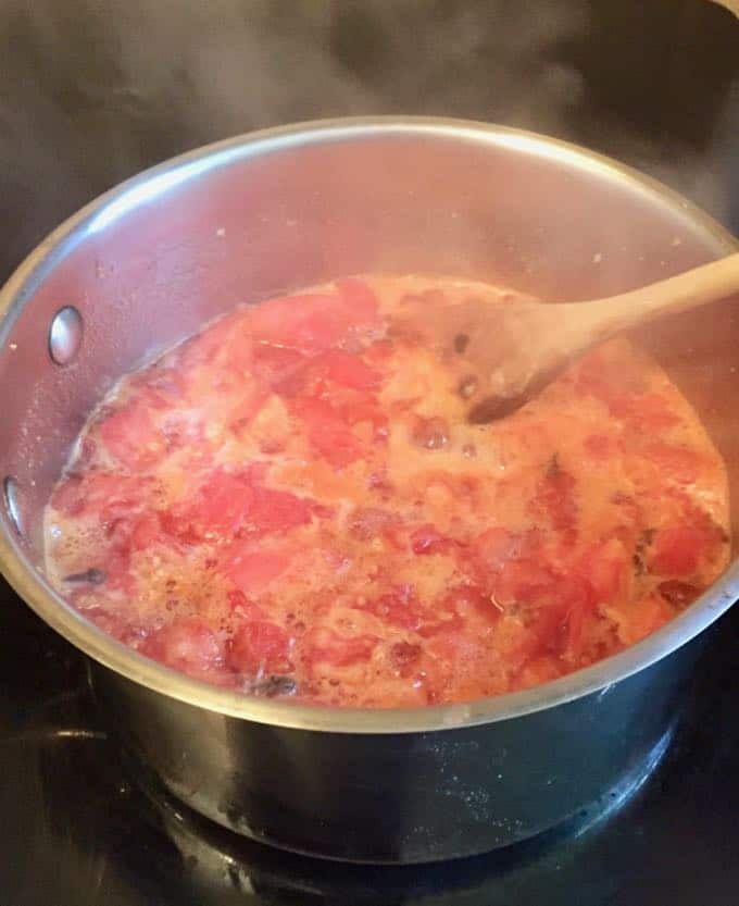 Cooking tomato jam for Cornmeal Cookies with Tomato Jam