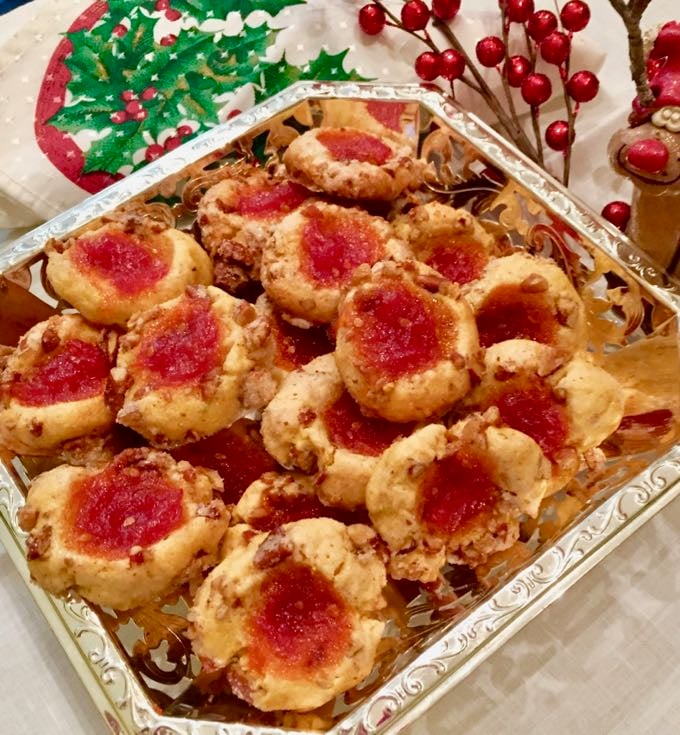 A silver serving dish with Cornmeal Cookies with Tomato Jam