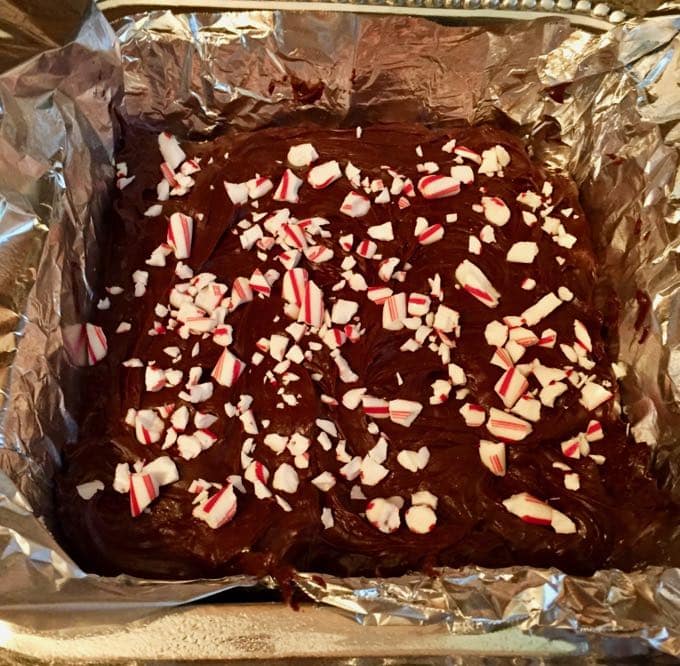 Easy Chocolate Fudge in a pan lined with aluminum foil.