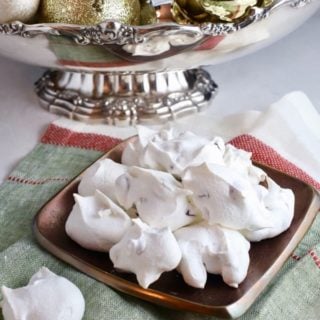 Forgotten cookies on a small plate on a red, white, and green napkin.