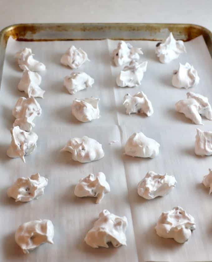 A baking sheet with forgotten cookie meringue ready to be put in the oven.