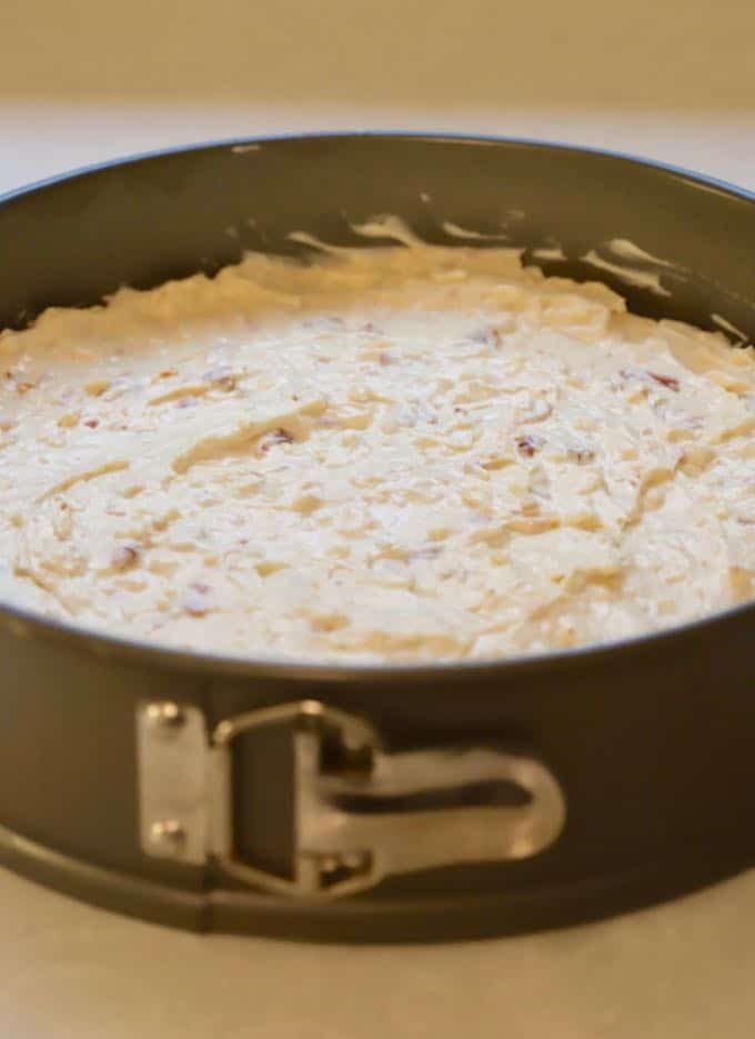 Cheesecake batter in a springform pan to make Savory Havarti and Sun-Dried Cheesecake.