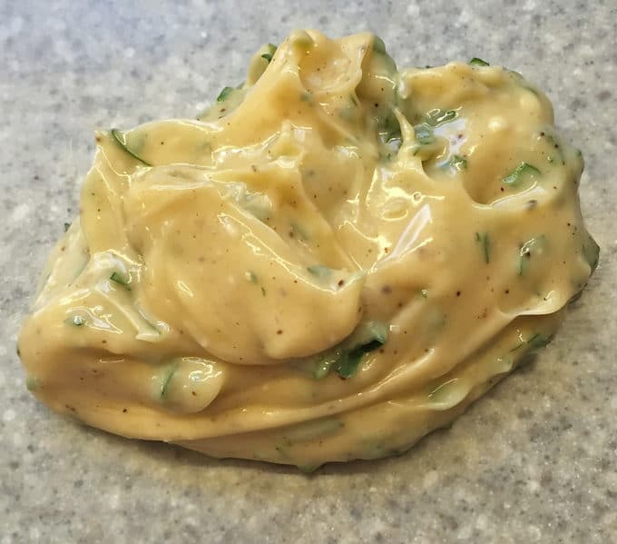 A large glob of butter with parsley, maple syrup and bourbon mixed in.