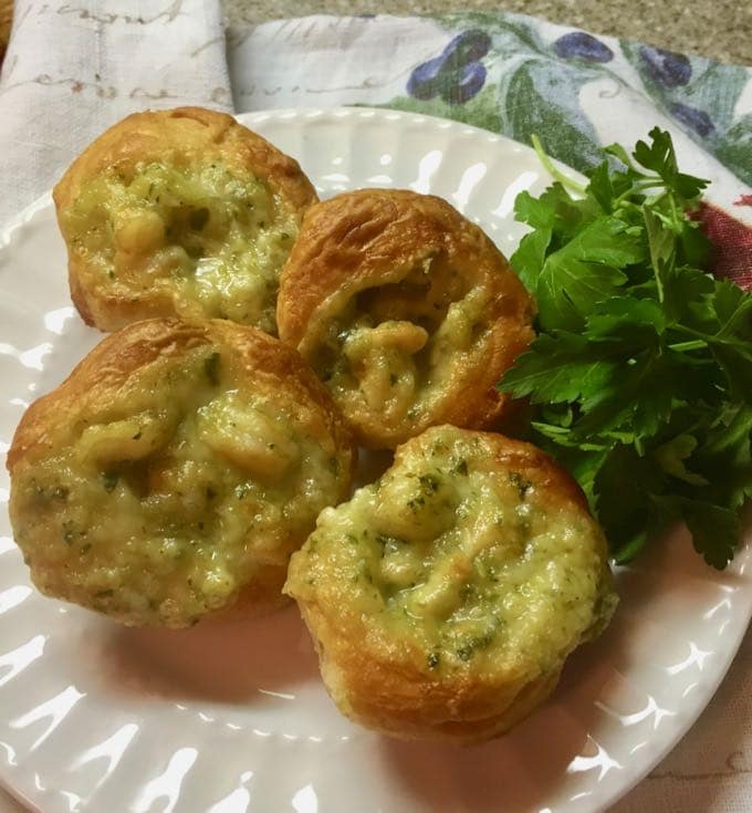 Easy Shrimp Puff Appetizers on a white plate garnished with parsley.