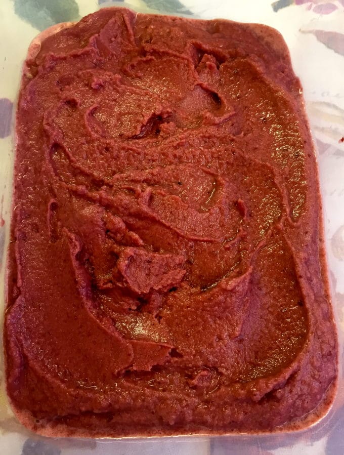 Cherry Pomegranate Sherbet ready in an air-tight container.