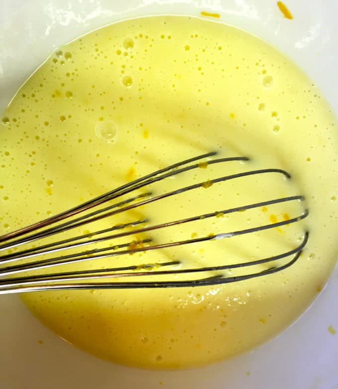 In a large bowl are the wet ingredients mixed with a whisk.