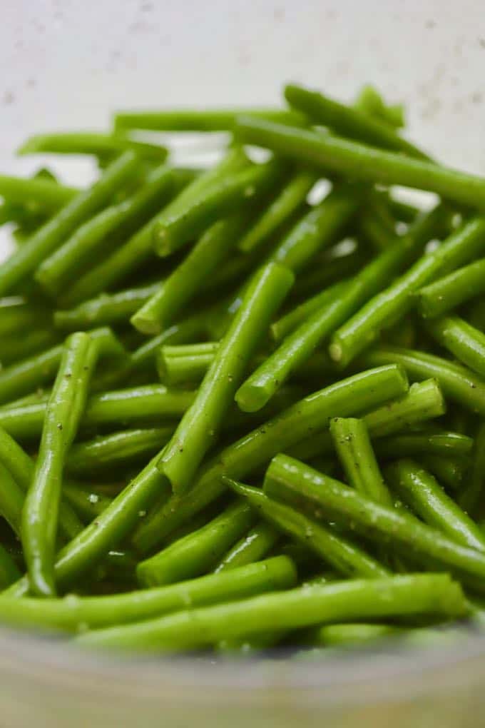 A bowl of cut up fresh green beans.