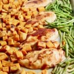 One Pan BBQ Chicken, Potatoes, and Green Beans on a sheet pan right out of the oven.