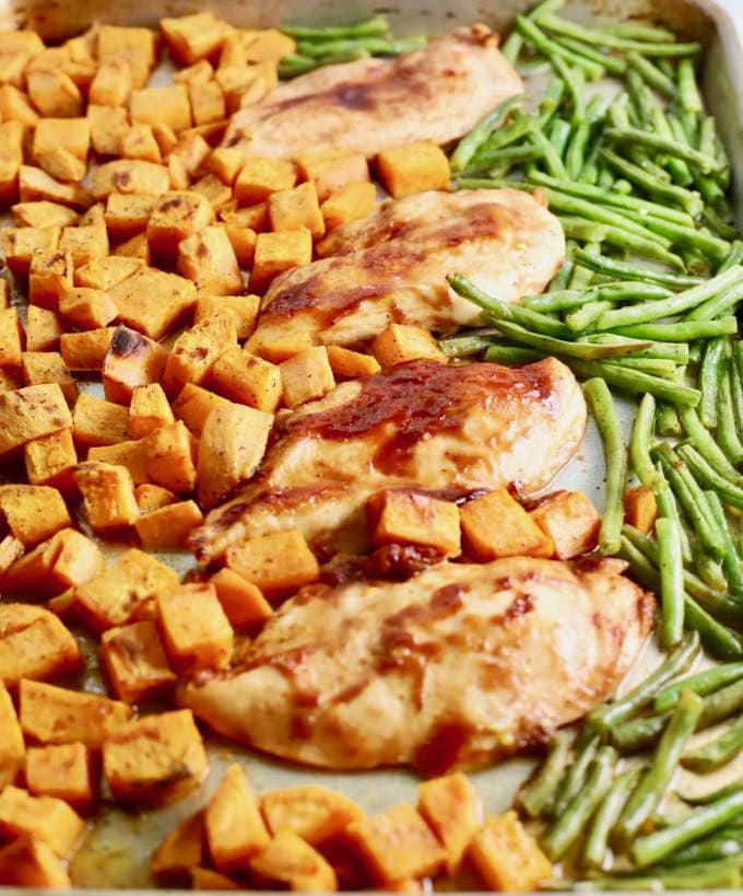 One Pan BBQ Chicken, Potatoes, and Green Beans on a sheet pan right out of the oven.