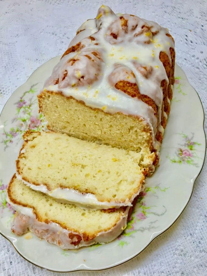 Southern Style Limoncello Cake sliced on a China platter.