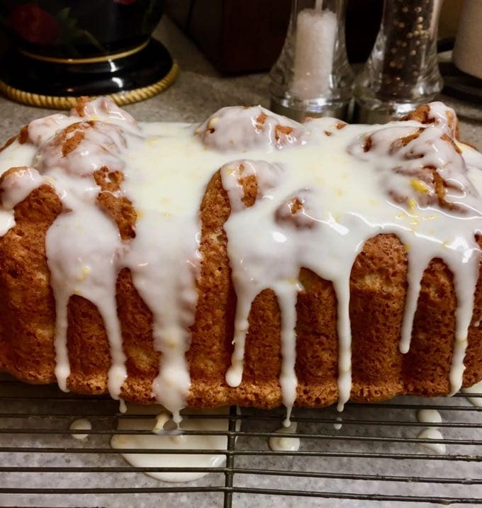 Southern Style Limoncello Cake with the glaze on a wire rack.