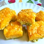 Five pieces of green chili pie on a white plate.