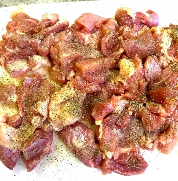Cut up chicken thighs seasoned with salt and pepper. 