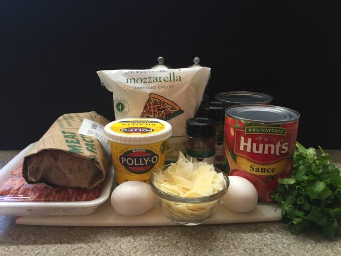 Ingredients for Easy Make Ahead Baked Ziti including sausage, cheese and tomato sauce