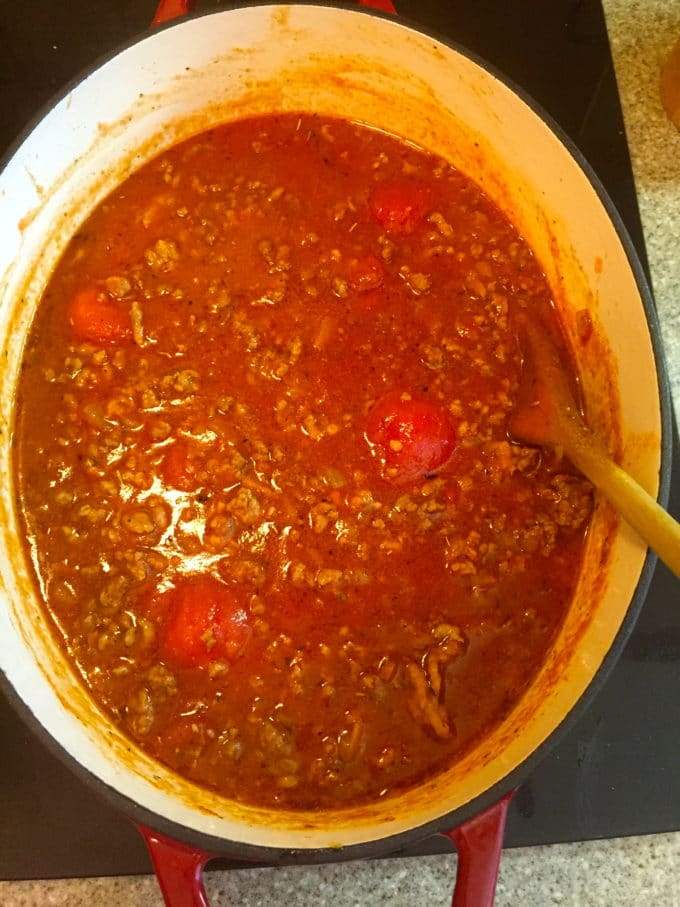 Cooking the tomato sauce and meat in a dutch oven for Easy Make-Ahead Baked Ziti 