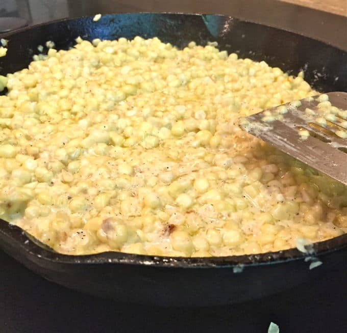 Cooking creamed corn in a cast iron skillet.