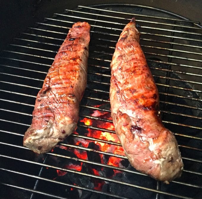 Two pork tenderloins on the grill to make Grilled Pork Tenderloin with Dark Cherry Sauce