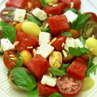 Southern Watermelon Tomato Salad garnished with fresh basil
