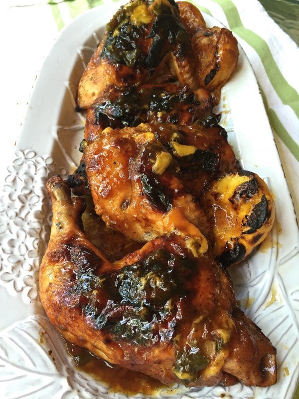 Grilled Chicken with Peach Glaze on a white serving platter.