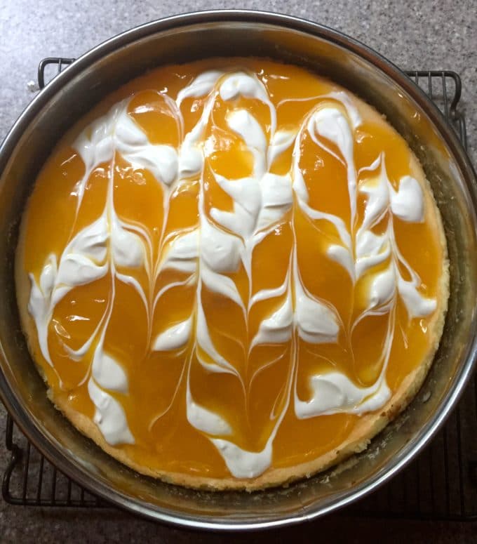 cheesecake in a 9-inch springform pan with cheesecake topping.