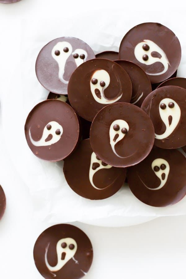 Two Ingredient Ghost Chocolate Cups made with chocolate with a ghost swirled on top. 