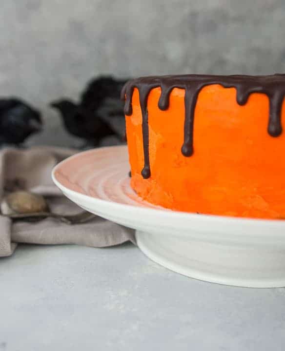 Black Velvet Cheesecake Cake with orange icing for Halloween.