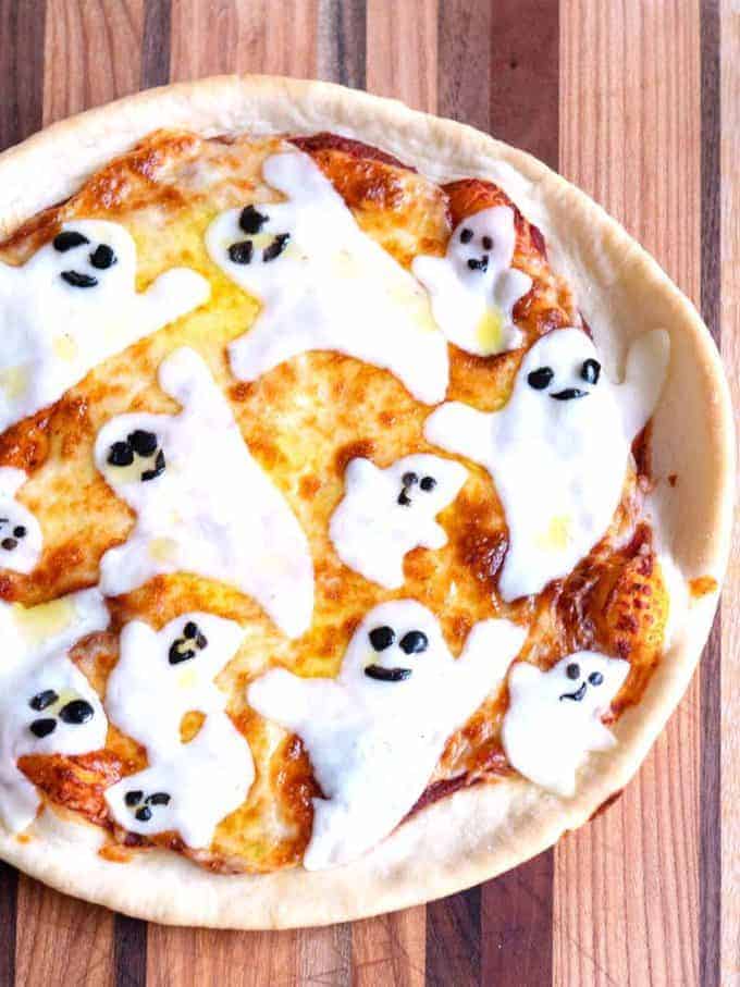Halloween Ghost Pizza with mozzarella ghosts on top.