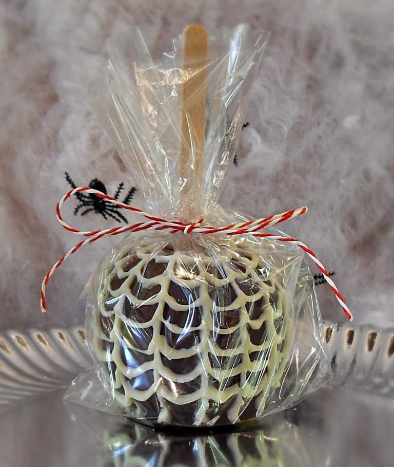 Halloween Chocolate Apple wrapped in cellophane .