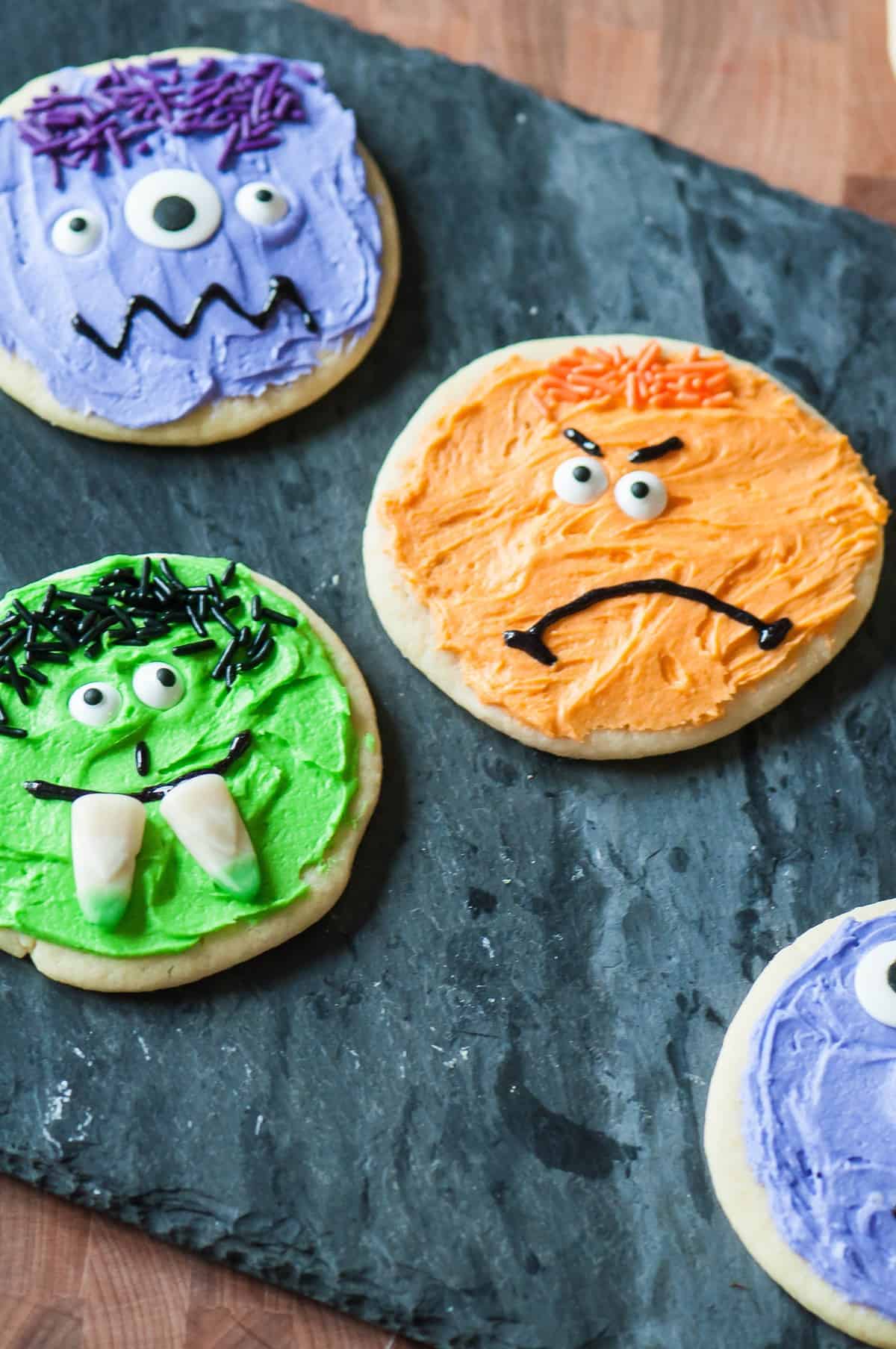 Four Halloween Monster Sugar Cookies decorated like monsters.