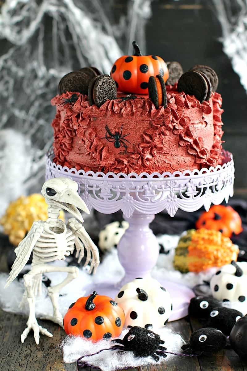 Halloween Cake garnished with pumpkins and other Halloween decorations.