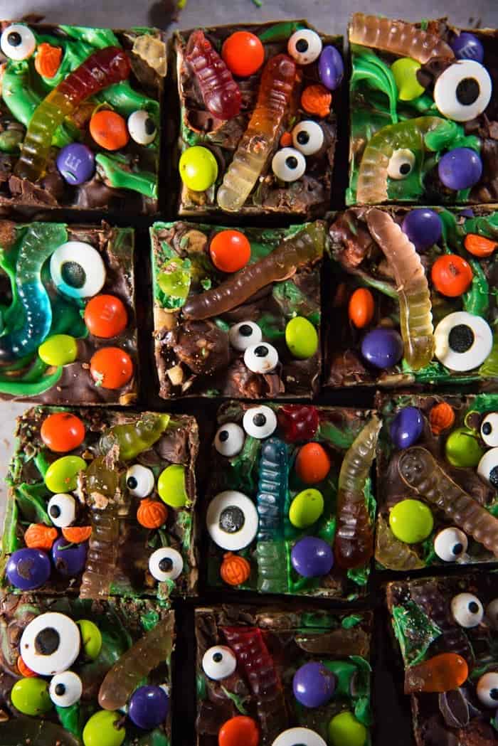 Halloween Rocky Road Slices covered in goggly eyes and gummy worms.