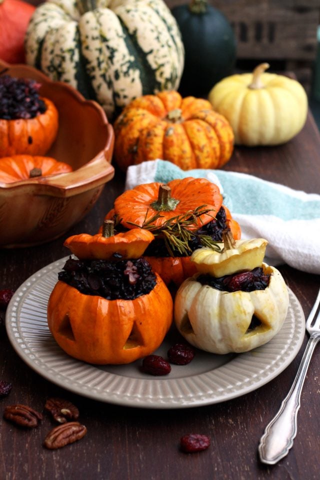 Small carved Halloween Pumpkins stuffed with rice.