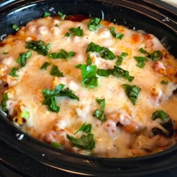 Slow Cooker Chicken Broccoli Pasta in a black slow cooker with the lid off