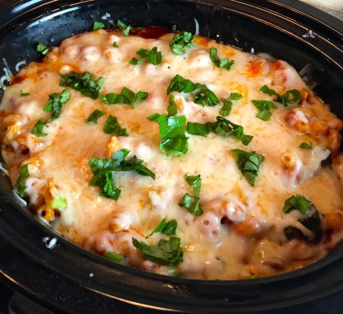 Slow Cooker Chicken Broccoli Pasta in a black slow cooker with the lid off