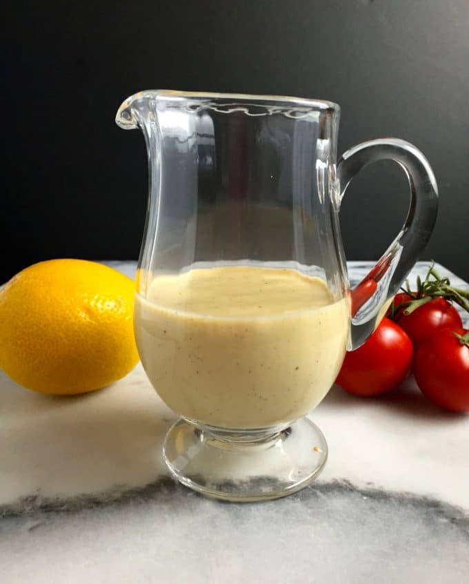 A pitcher full of Caesar Salad Dressing.