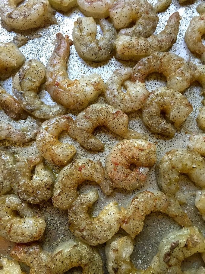 Raw shrimp on a baking sheet for Easy Ten Minute Roasted Shrimp