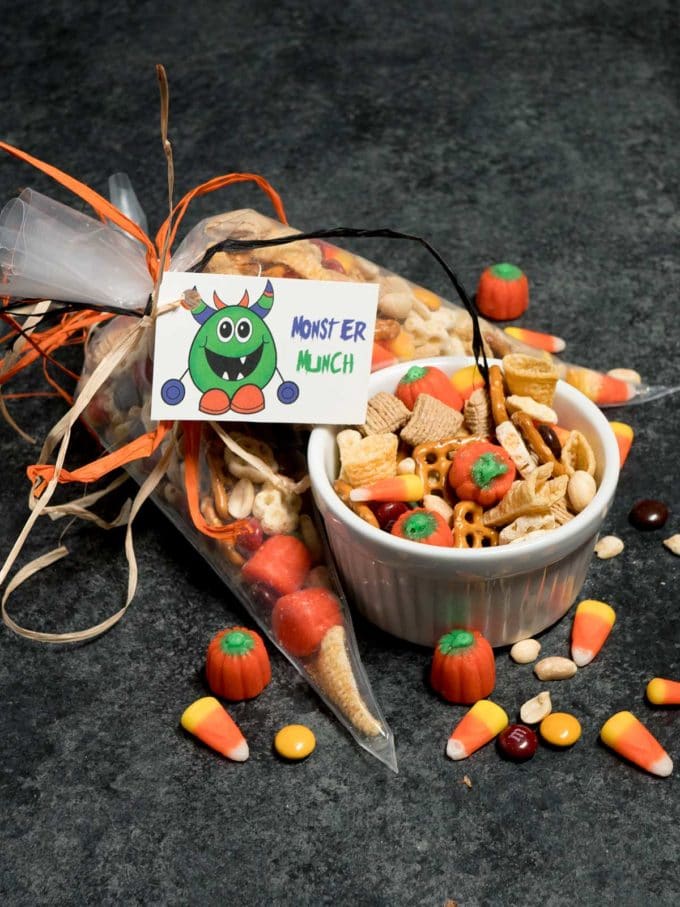 Halloween Monster Munch wrapped up in a plastic bag and tied with orange and black ribbon.
