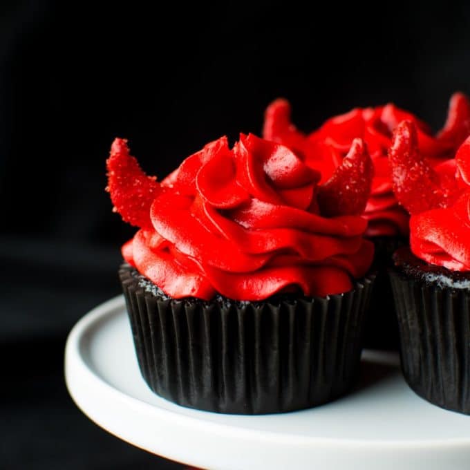 Spicy Devils Food Cupcakes - Chocolate cupcakes topped with red icing in the shape of horns. 