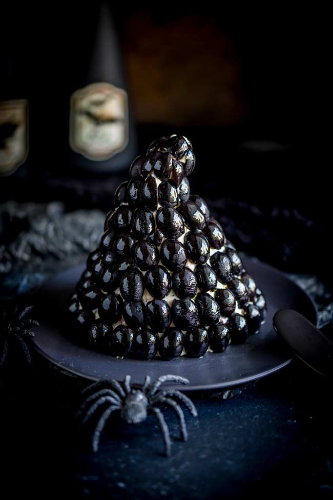 Witches Hat Cheese Ball made with cheese and black olives in the shape of a witches hat.