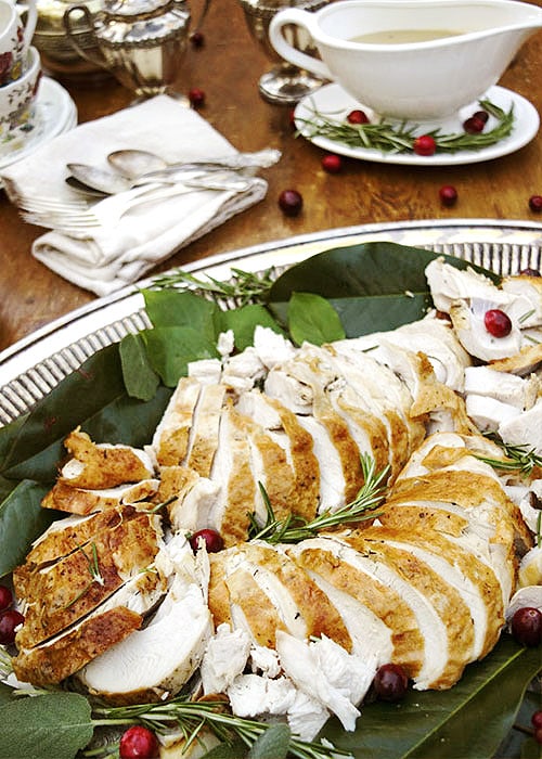 Emergency Turkey slices on a beautiful silver platter garnished with herbs.