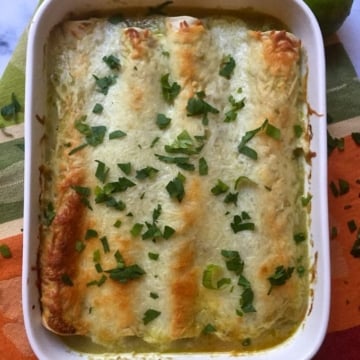 Turkey Enchiladas in a white baking dish.