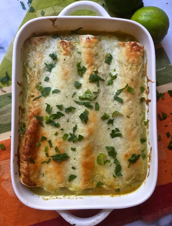  Turkey Enchiladas in a white baking dish.