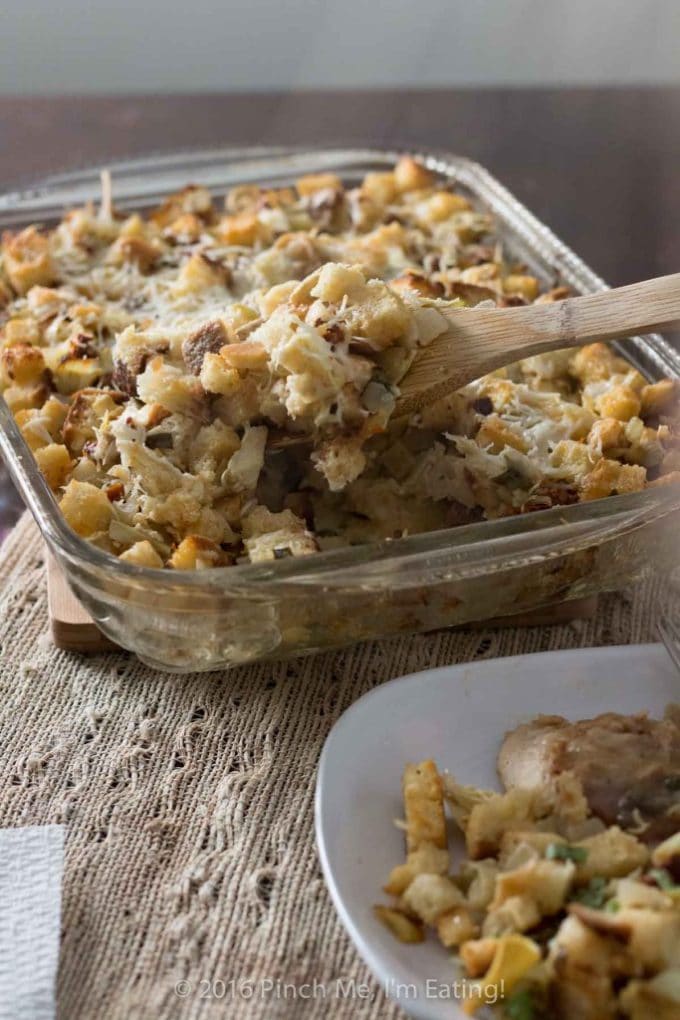 Sun dried Tomato and artichoke dressing in a clear glass baking dish. 