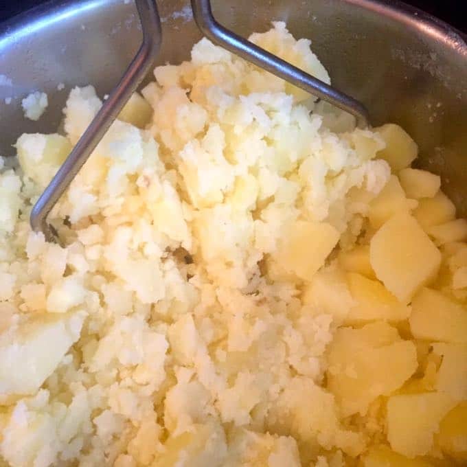 Mashing the potatoes for Pancetta and Rosemary Mashed Potatoes