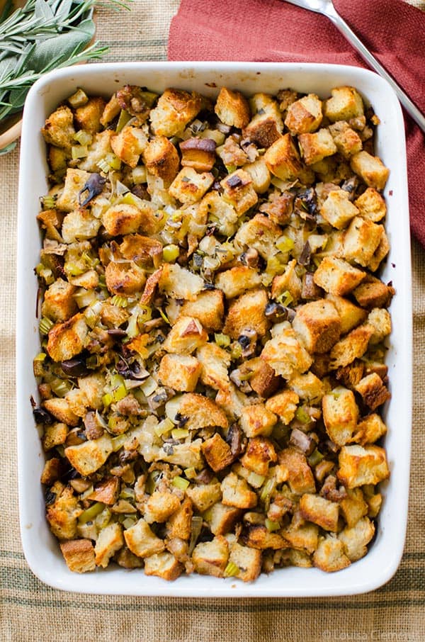 Sourdough Thanksgiving Stuffing in a white glass baking dish. 