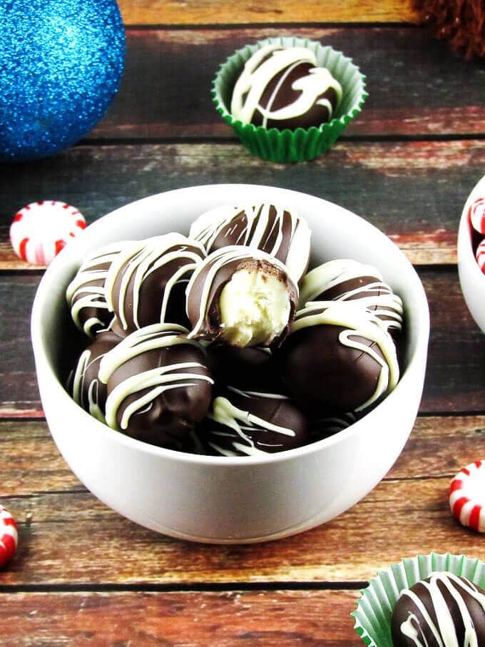 Dark chocolate peppermint truffles in a white bowl. 