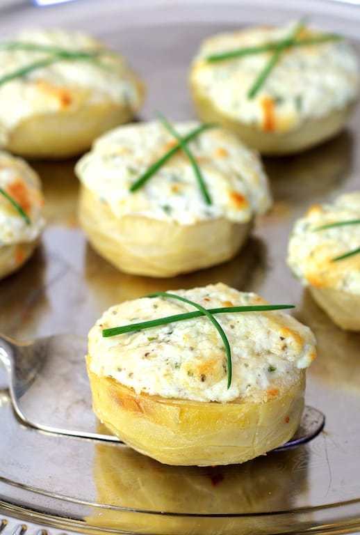 Goat cheese stuffed artichoke bottoms garnished with chives. 