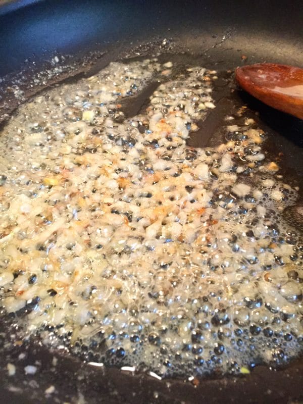 Butter, shallots, and garlic in a skillet.