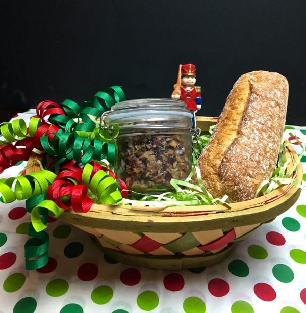 Mixed Olive Tapenade in a gift basket with a baguette and ribbons.